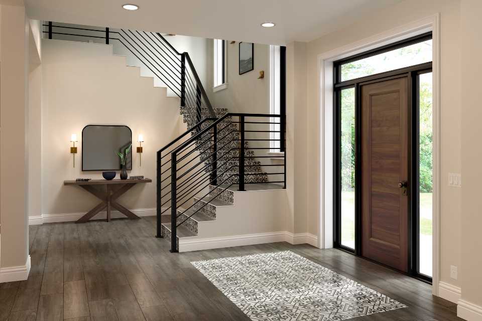 dark wood look in entryway with black and white tile inlay and tiled staircase